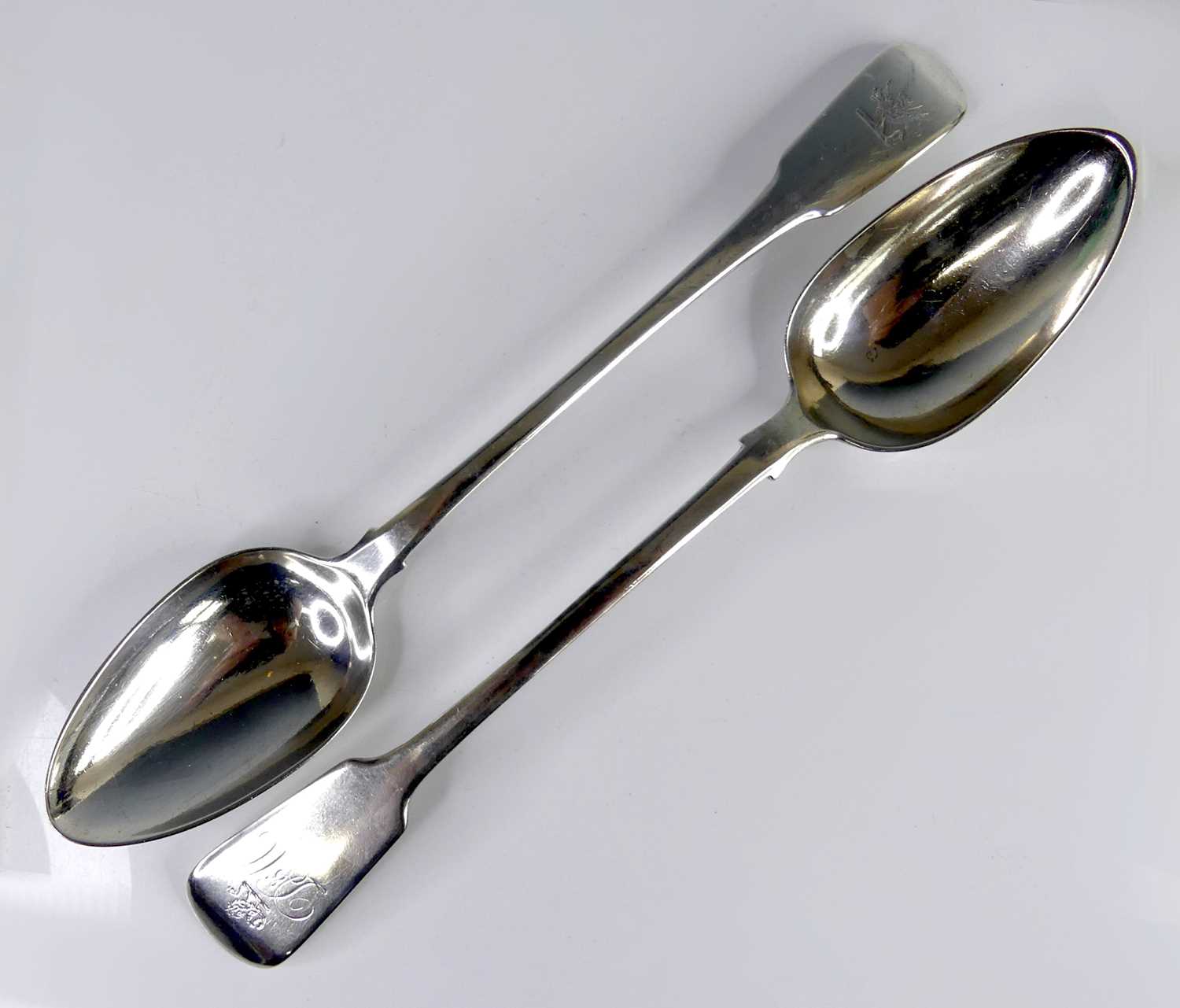 Lot 2090 - Two Georgian silver stuffing spoons, in the...