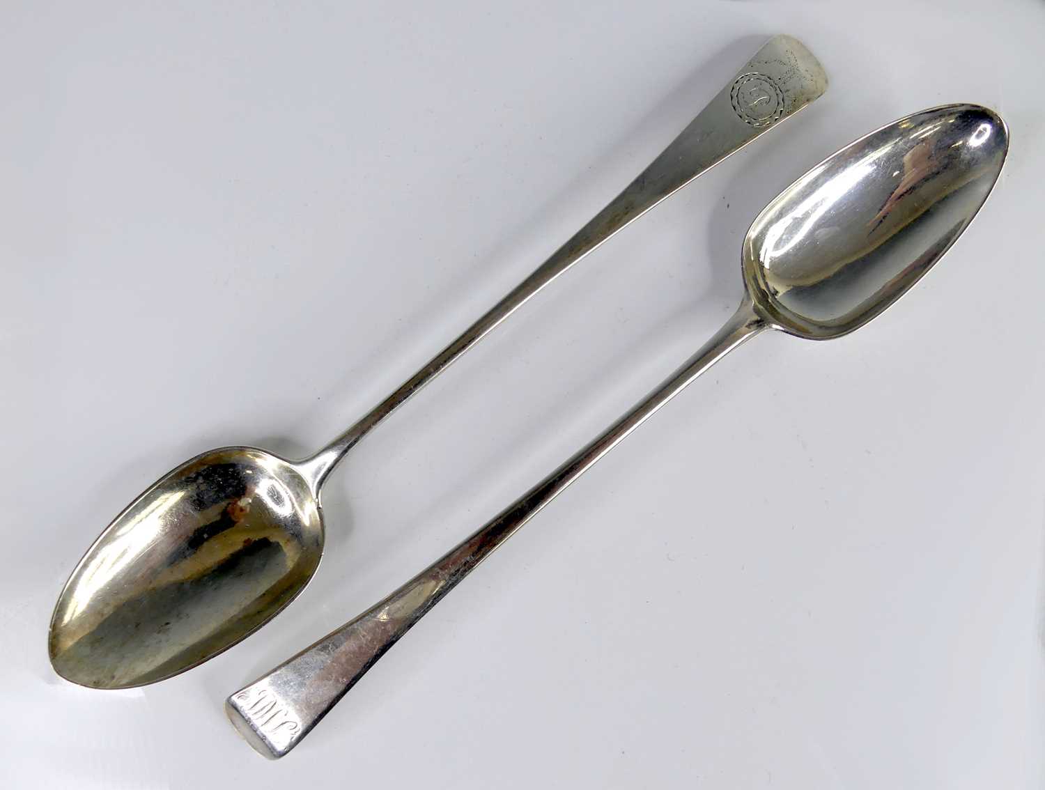 Lot 2089 - Two George III silver serving spoons, in the...