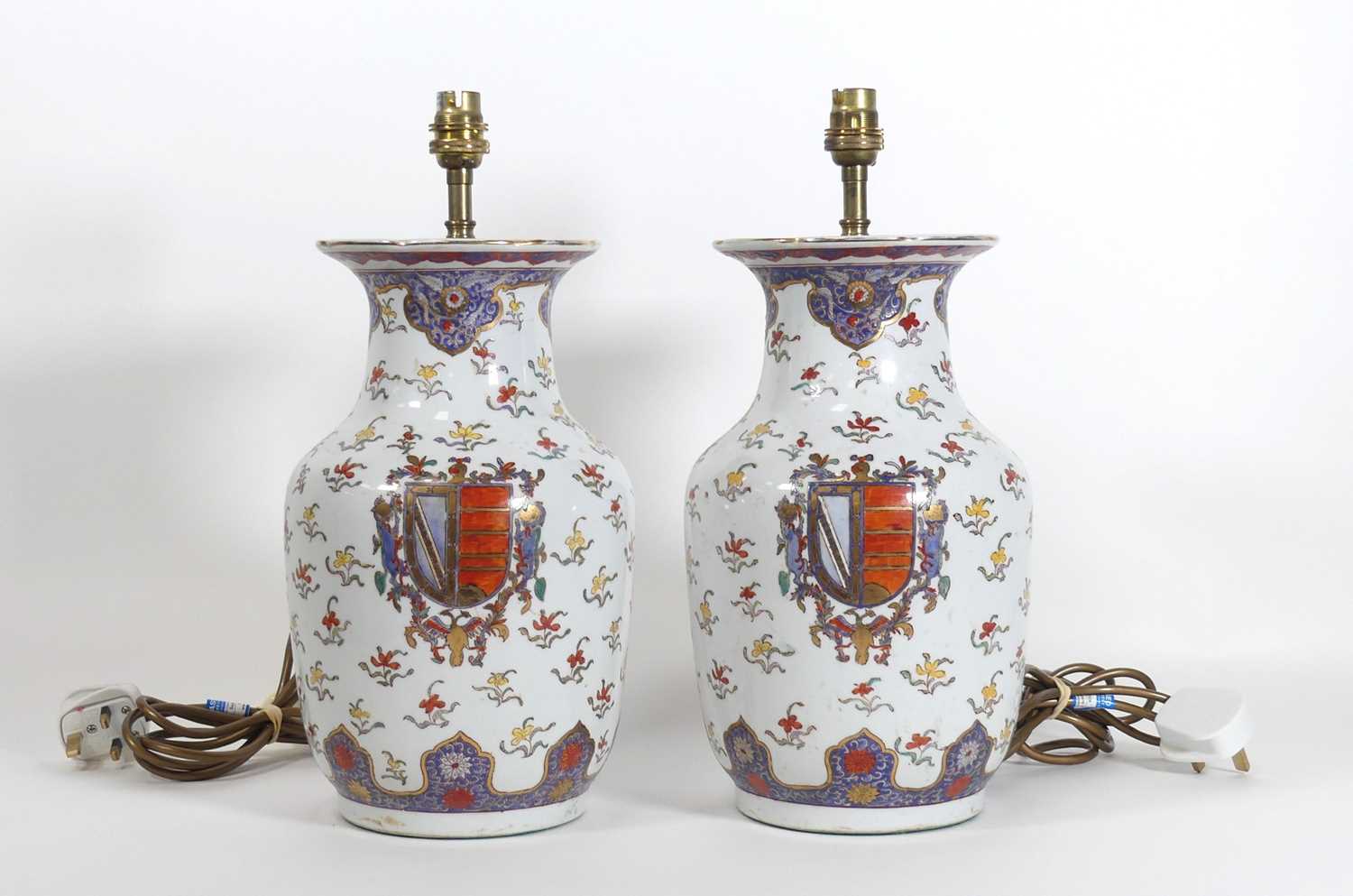 Lot 8 - A pair of Chinese style armorial porcelain...
