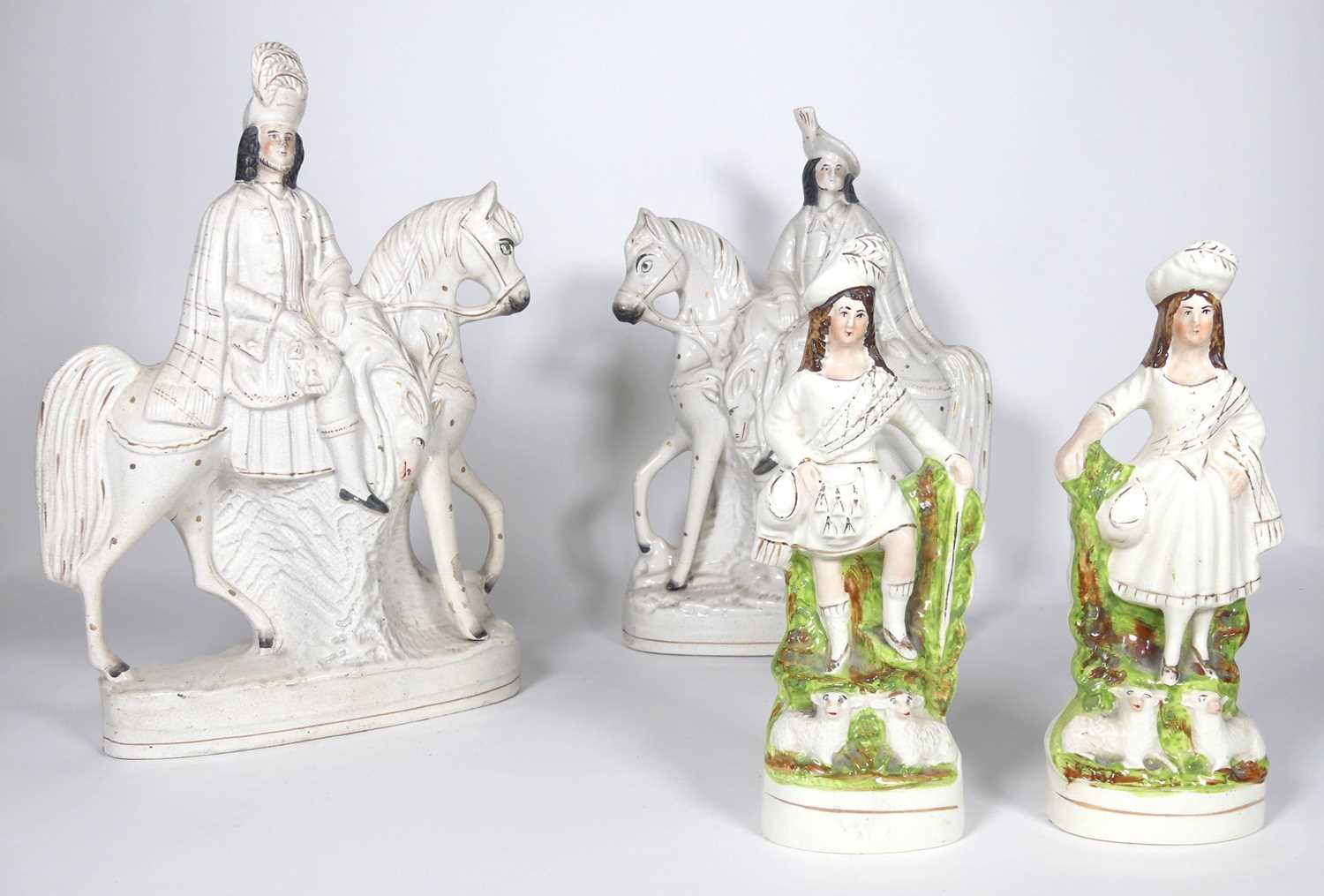Lot 41 - A pair of Staffordshire pottery figures of...