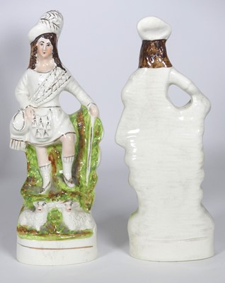 Lot 41 - A pair of Staffordshire pottery figures of...