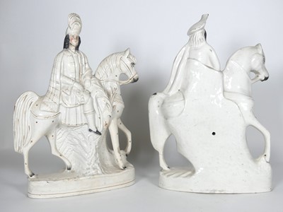Lot 41 - A pair of Staffordshire pottery figures of...