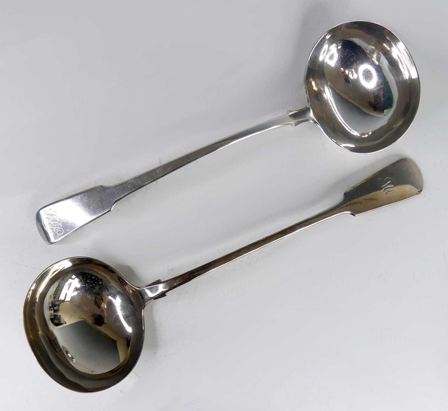 Lot 2102 - A George III silver soup ladle, in the Fiddle...