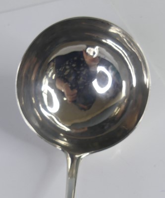 Lot 2101 - An early George III silver soup ladle, in the...