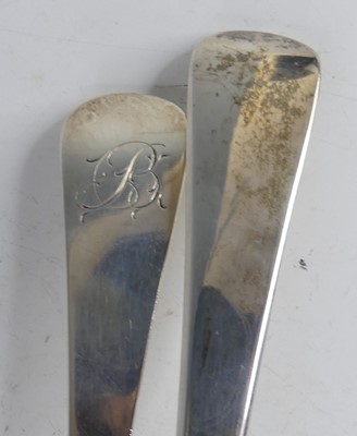 Lot 2106 - Two George III silver soup ladles, in the old...