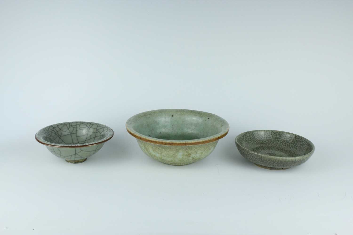 Lot 104 - A group of three Chinese celadon bowls, Ming...