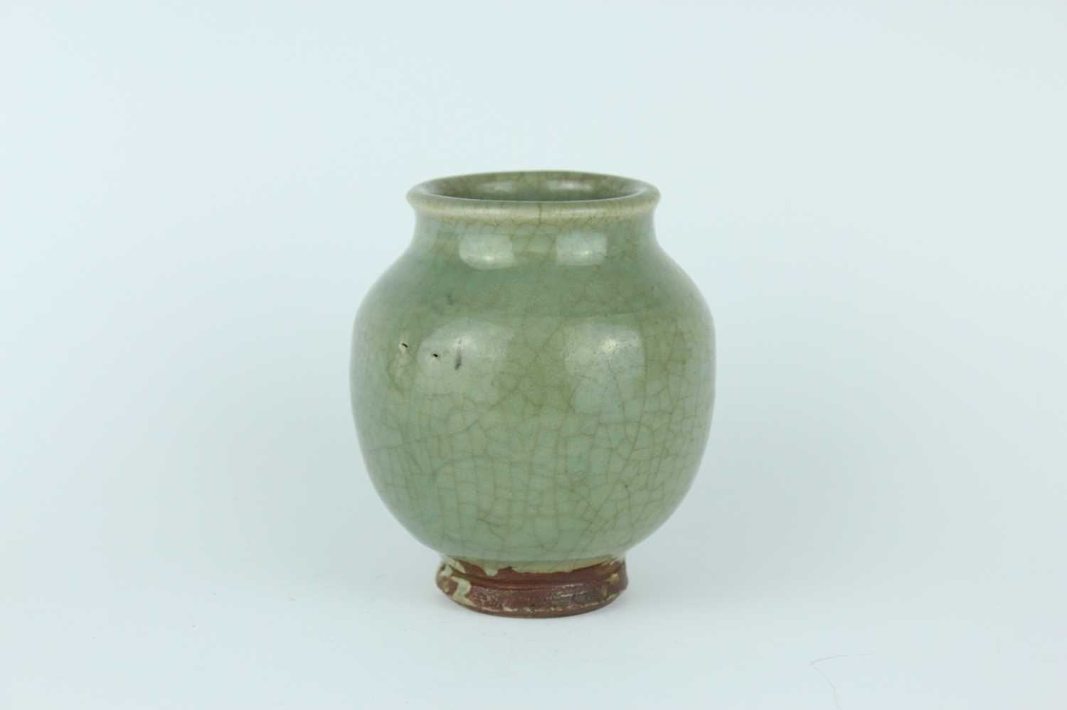Lot 100 - A Chinese Longquan celadon jar, Ming Dynasty...