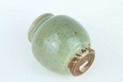 Lot 100 - A Chinese Longquan celadon jar, Ming Dynasty...