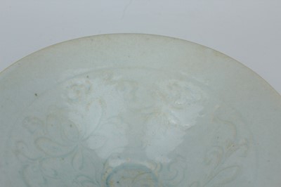 Lot 110 - A Chinese Qingbai bowl with carved foliage...