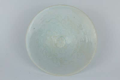 Lot 110 - A Chinese Qingbai bowl with carved foliage...