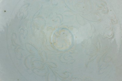 Lot 110 - A Chinese Qingbai bowl with carved foliage...