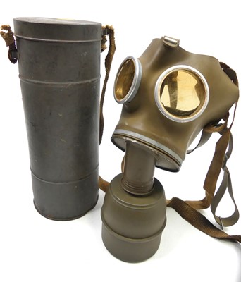 Lot 476 - A WWII Military gas mask, in cylindrical metal...