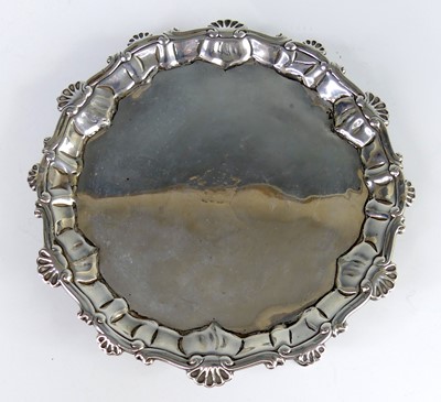 Lot 2229 - An early George III silver card waiter, having...