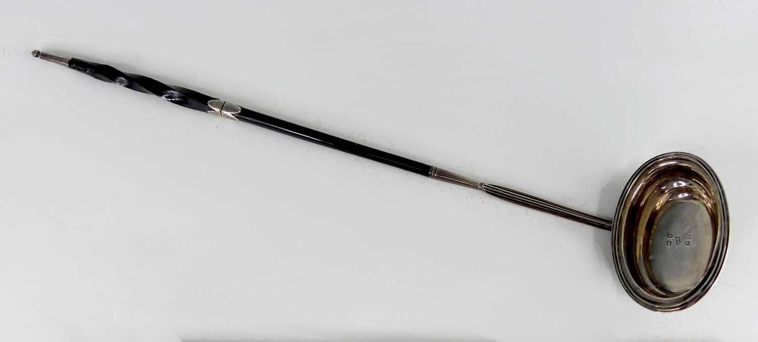 Lot 2073 - A George III silver toddy ladle, having spiral...