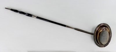 Lot 2073 - A George III silver toddy ladle, having spiral...