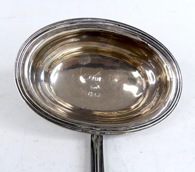 Lot 2073 - A George III silver toddy ladle, having spiral...