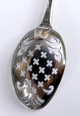Lot 2069 - A George III silver mote spoon, having cross...