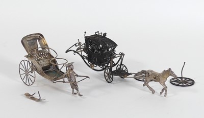 Lot 454 - A white metal model of a rickshaw, l.12cm,...