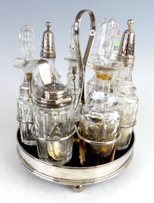 Lot 2196 - A George III silver seven-section cruet stand,...