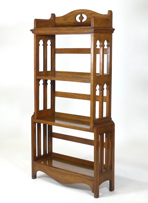 Lot 361 - An Arts and Crafts oak freestanding open...