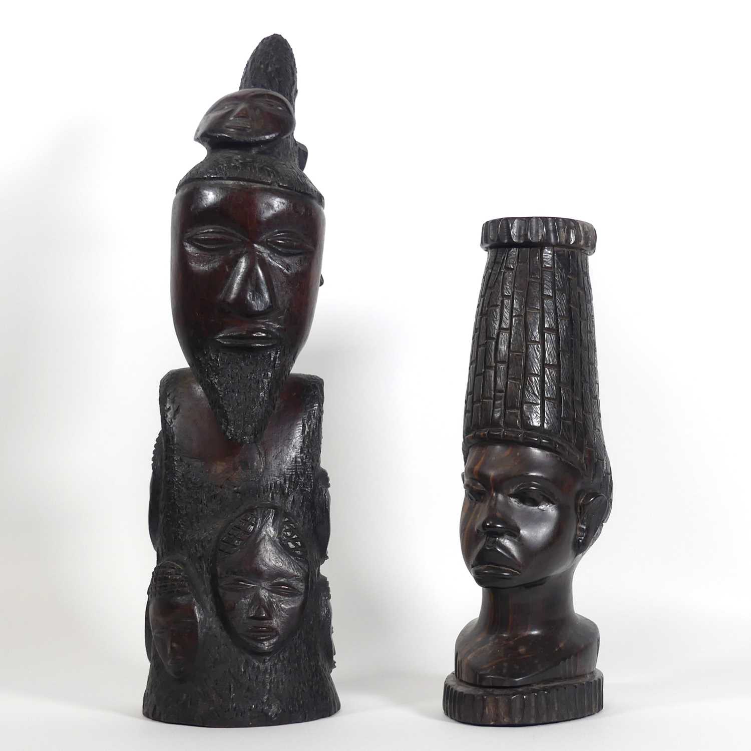Lot 44 - An African carved hardwood figure, with mask...