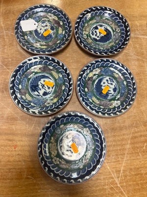 Lot 61 - A collection of nine Japanese polychrome...