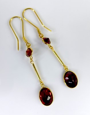 Lot 2537 - A pair of contemporary yellow metal and garnet...