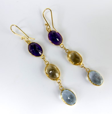 Lot 2572 - A pair of contemporary yellow metal earrings,...
