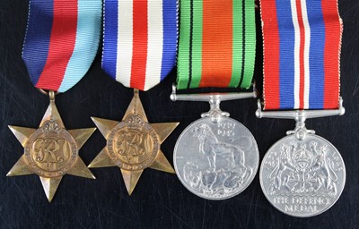 Lot 624 - A group of four WW II medals to include...