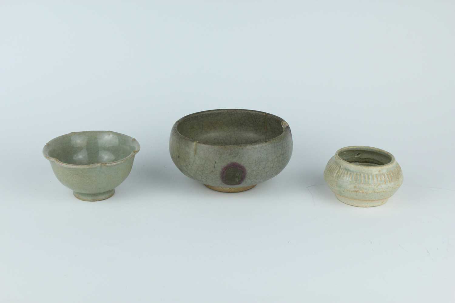Lot 107 - A group of three Chinese celadon wares, Song...