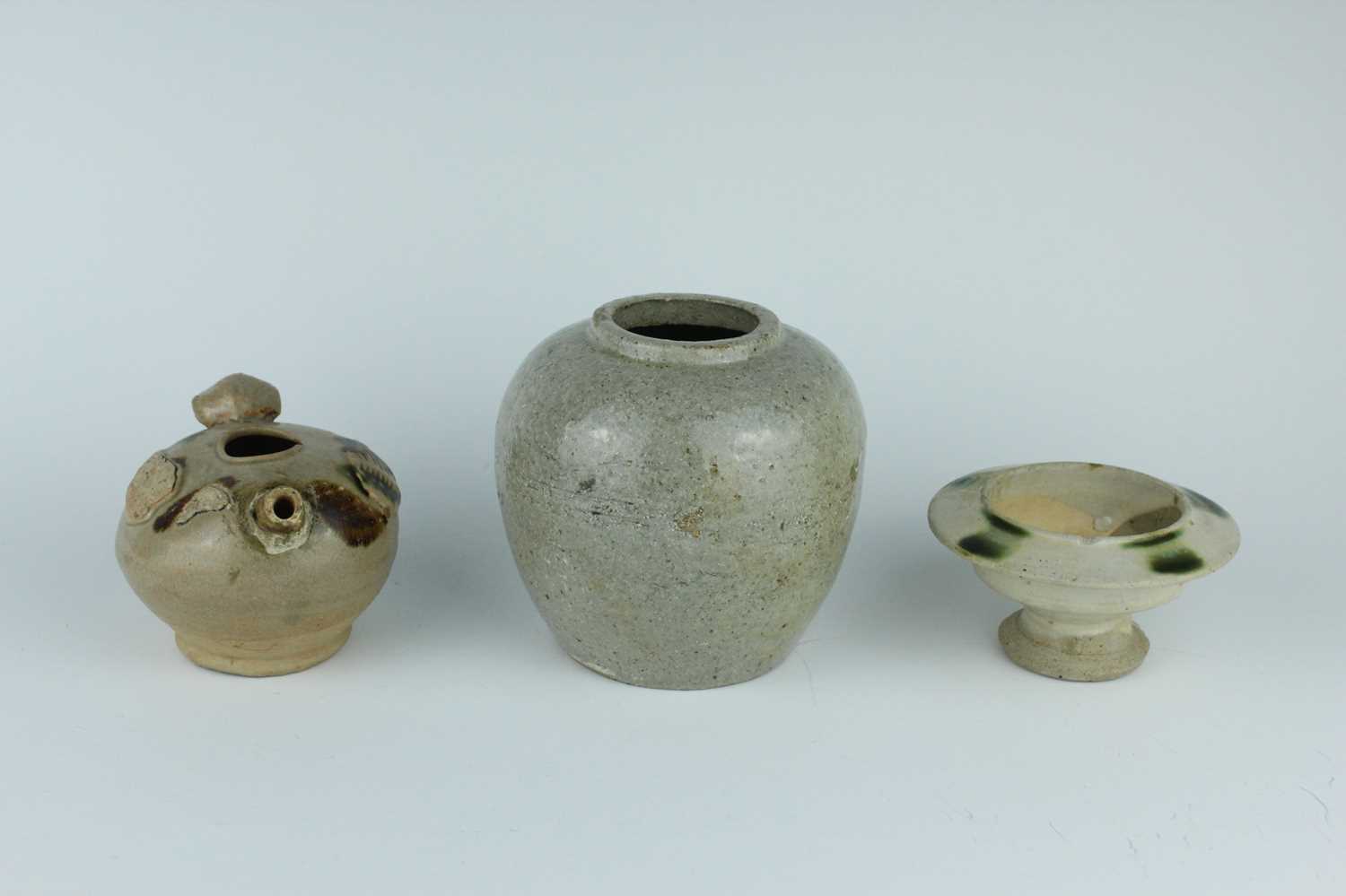 Lot 116 - Two Chinese Sancai-type wares and a celadon...