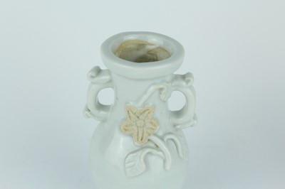 Lot 112 - A group of four small Chinese white and pale...