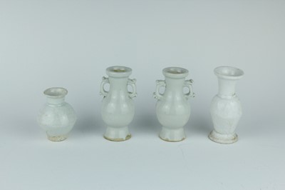 Lot 112 - A group of four small Chinese white and pale...