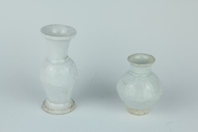 Lot 112 - A group of four small Chinese white and pale...