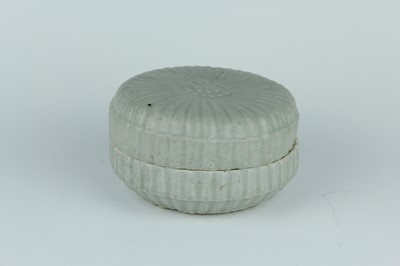 Lot 111 - A Chinese pale celadon-glazed box and cover,...