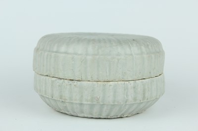 Lot 111 - A Chinese pale celadon-glazed box and cover,...