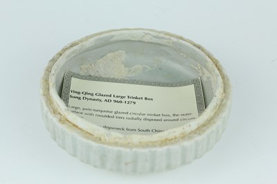 Lot 111 - A Chinese pale celadon-glazed box and cover,...