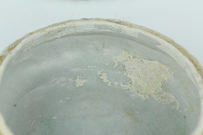 Lot 111 - A Chinese pale celadon-glazed box and cover,...