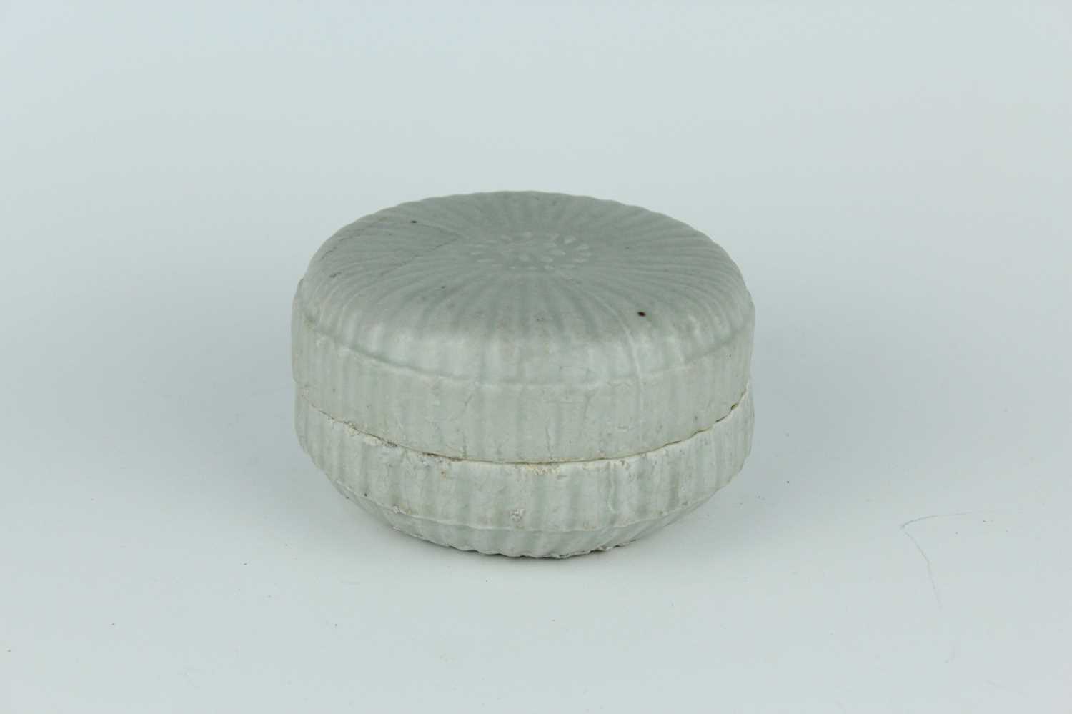 Lot 111 - A Chinese pale celadon-glazed box and cover,...