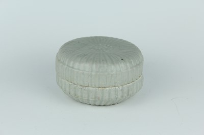 Lot 111 - A Chinese pale celadon-glazed box and cover,...