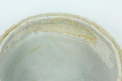 Lot 111 - A Chinese pale celadon-glazed box and cover,...