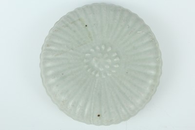 Lot 111 - A Chinese pale celadon-glazed box and cover,...