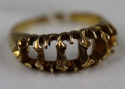 Lot 323 - A yellow metal half-hoop ring, formally set...