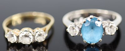 Lot 327 - A modern 9ct gold and cz set three-stone ring,...
