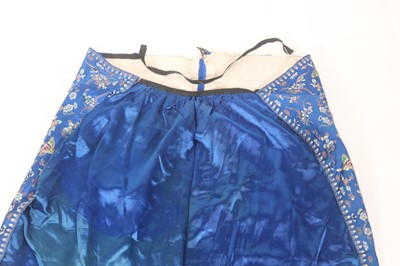 Lot 143 - A Chinese blue-ground silk embroidered lady’s...