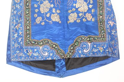 Lot 143 - A Chinese blue-ground silk embroidered lady’s...
