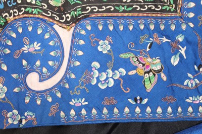 Lot 143 - A Chinese blue-ground silk embroidered lady’s...