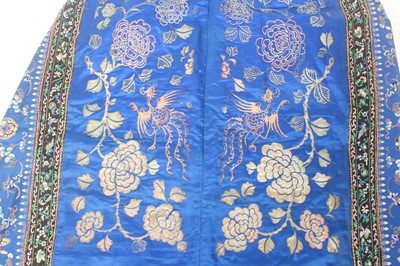 Lot 143 - A Chinese blue-ground silk embroidered lady’s...