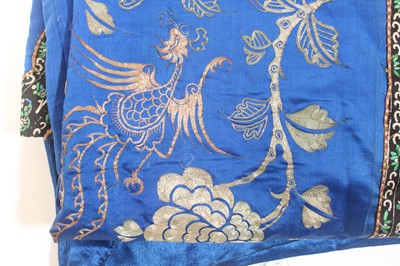 Lot 143 - A Chinese blue-ground silk embroidered lady’s...
