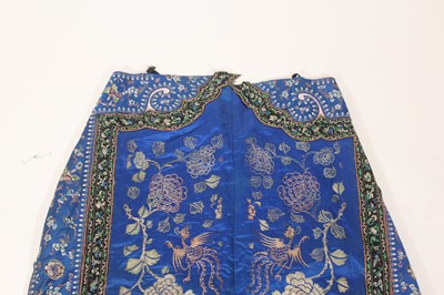 Lot 143 - A Chinese blue-ground silk embroidered lady’s...